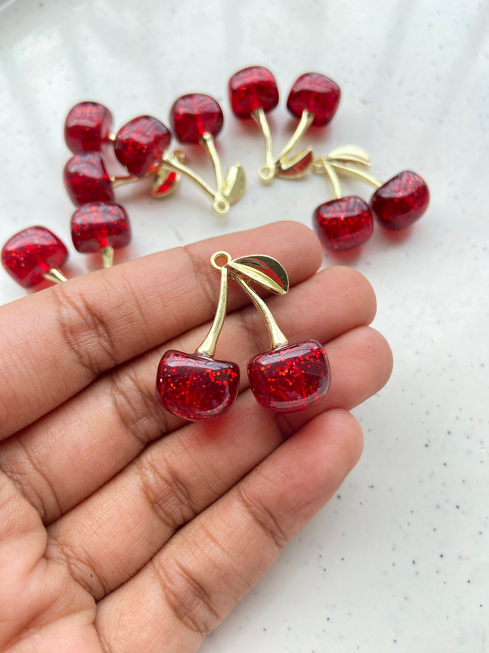 Thumbnail: Golden cherry resin with glitter alloy charm