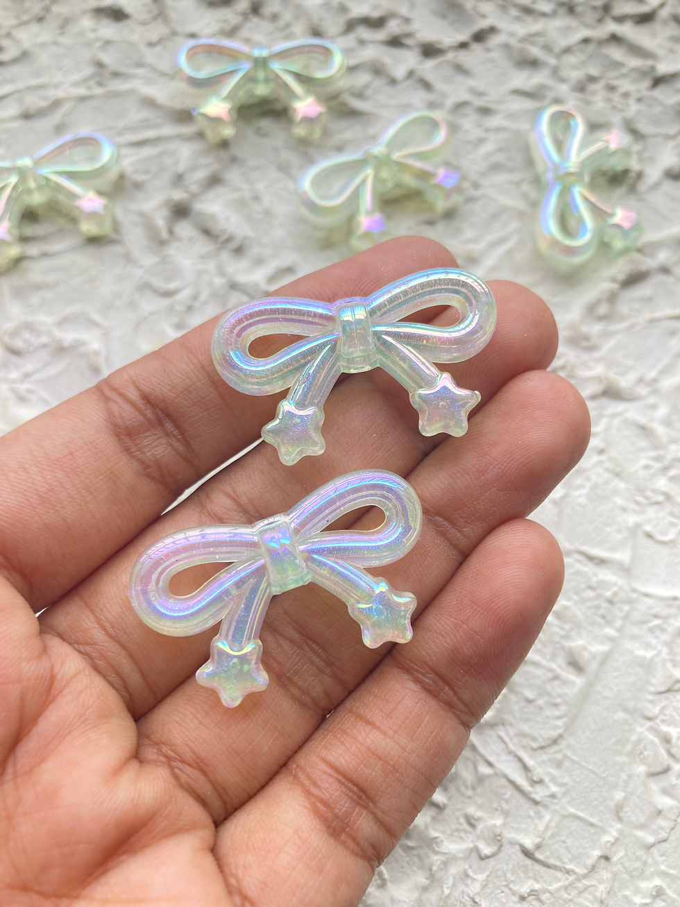 Thumbnail: Shiny bow with star acrylic bead, vertically drilled