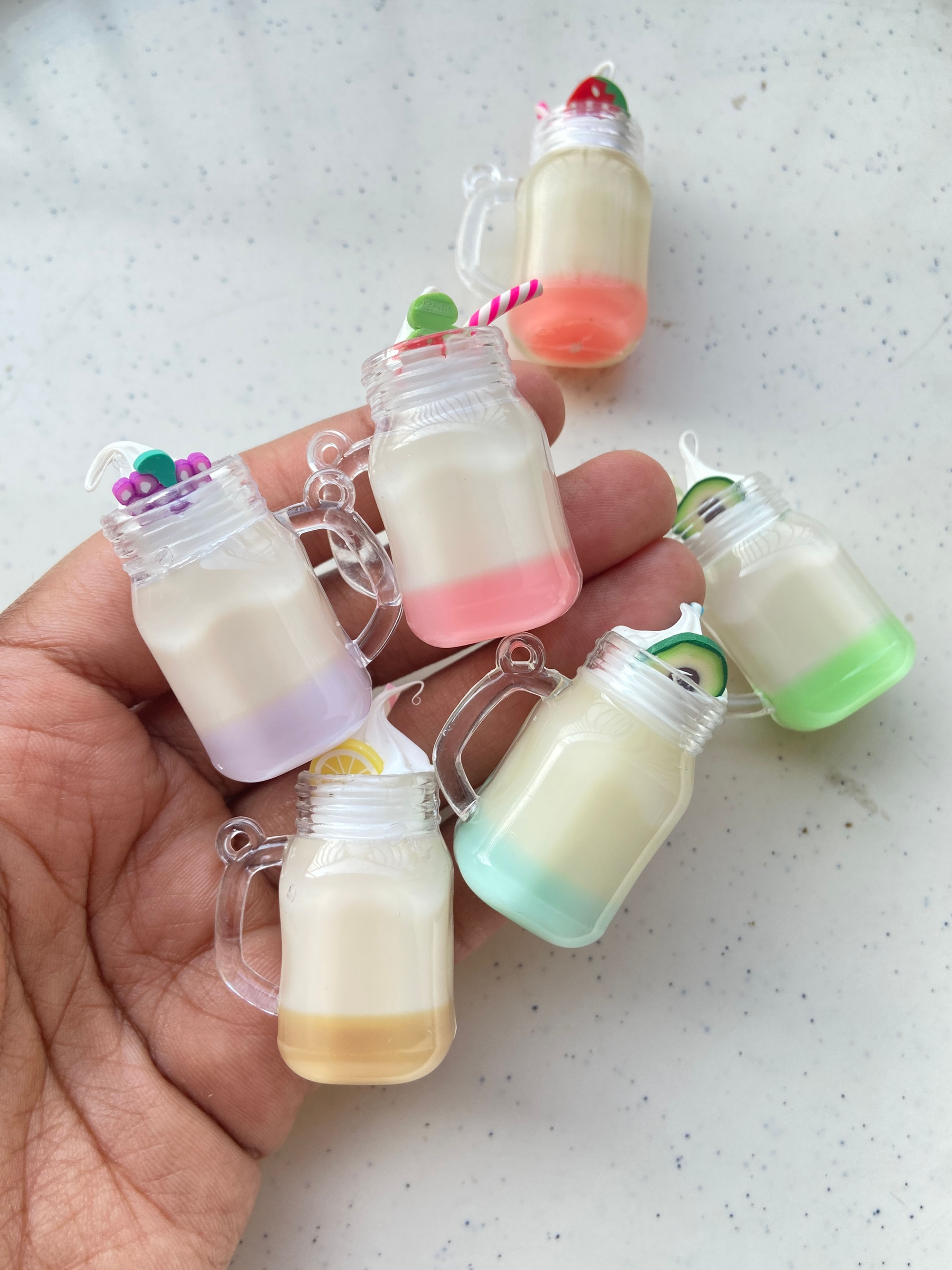 Beverage jar with resin charm