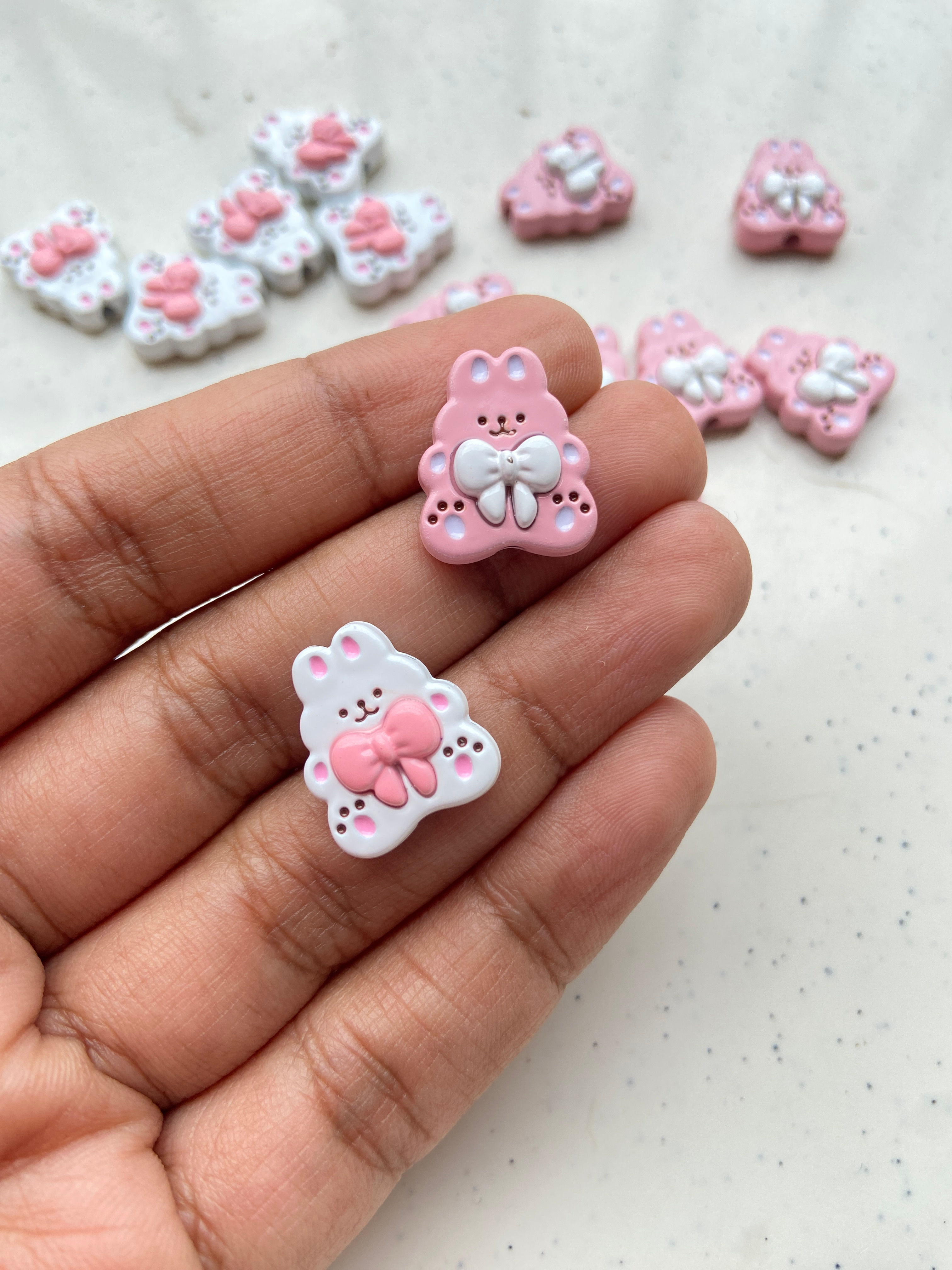 Alloy rabbit with bow bead, vertically drilled