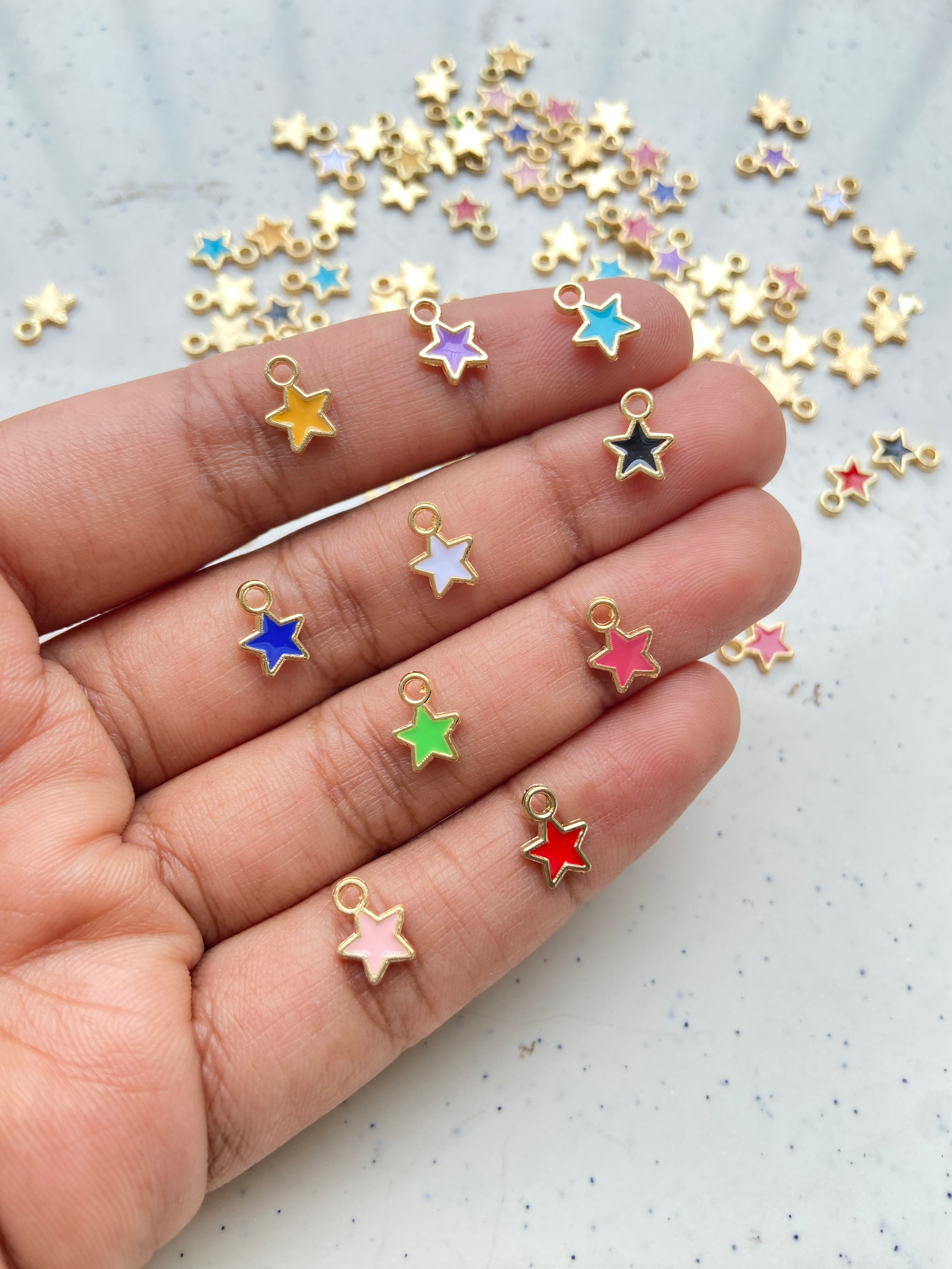 Tiny enamel star alloy charm