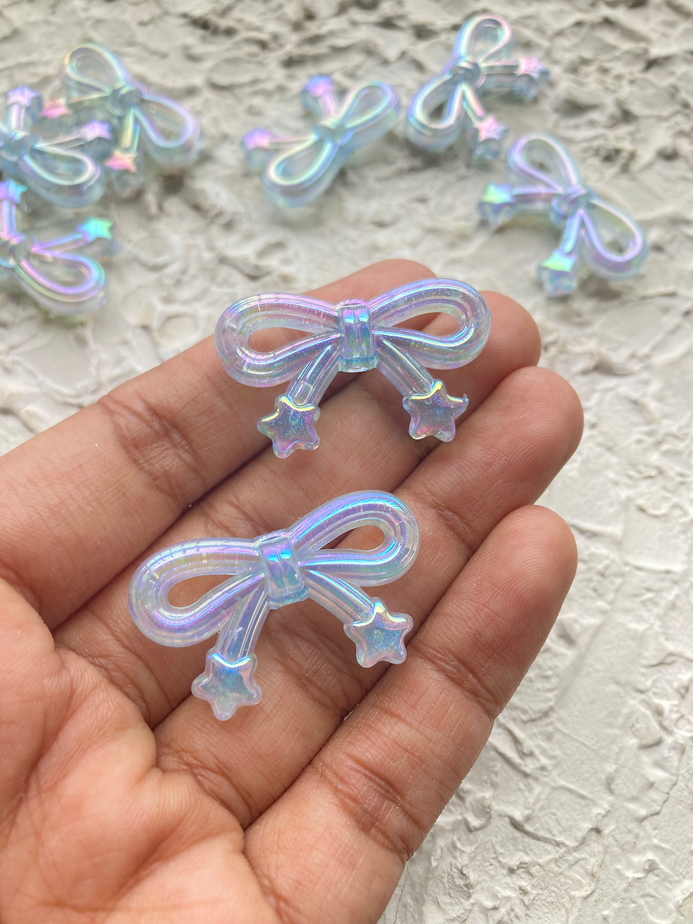 Thumbnail: Shiny bow with star acrylic bead, vertically drilled
