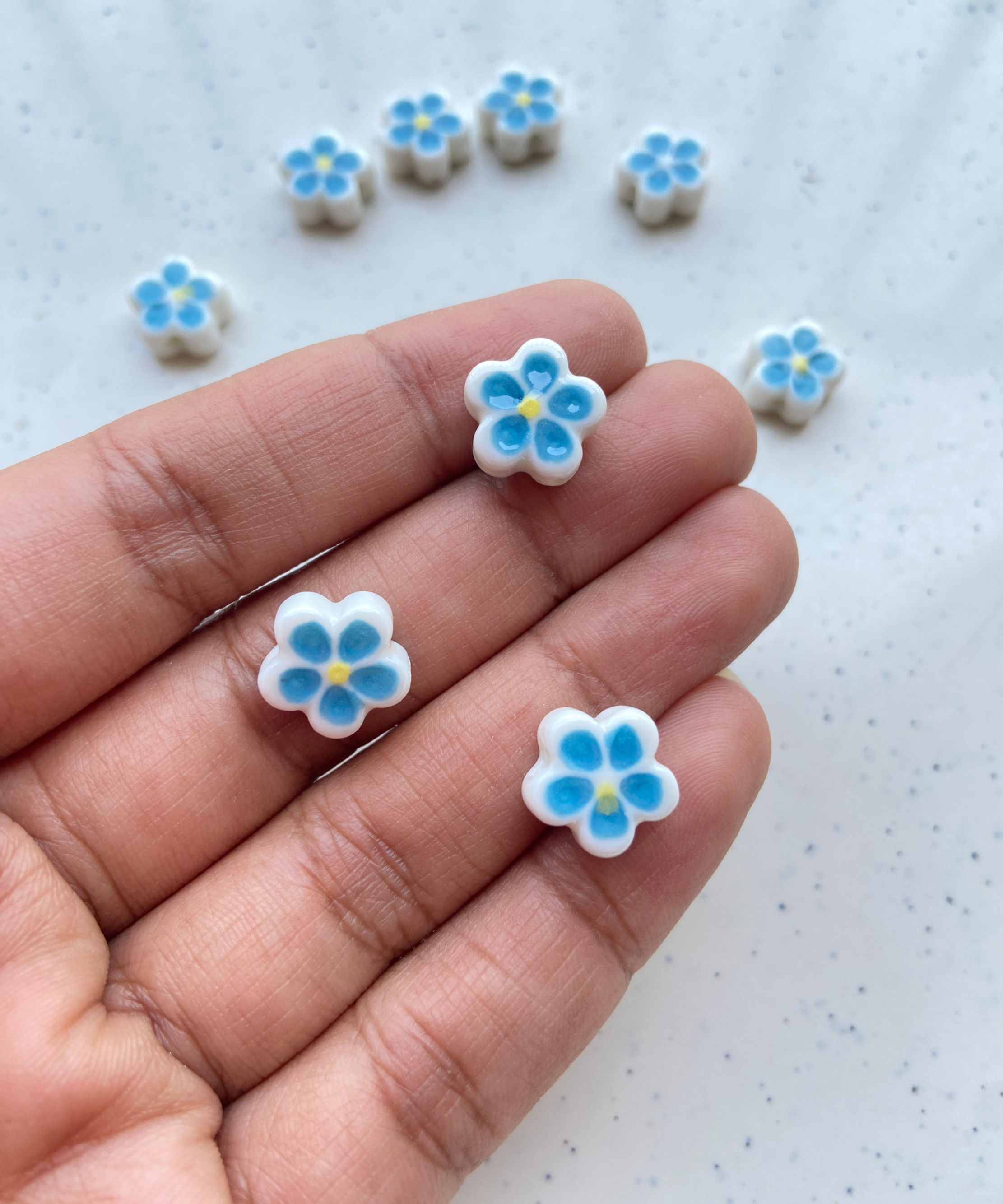 Shiny flower shape porcelain bead, vertically drilled (1pc)