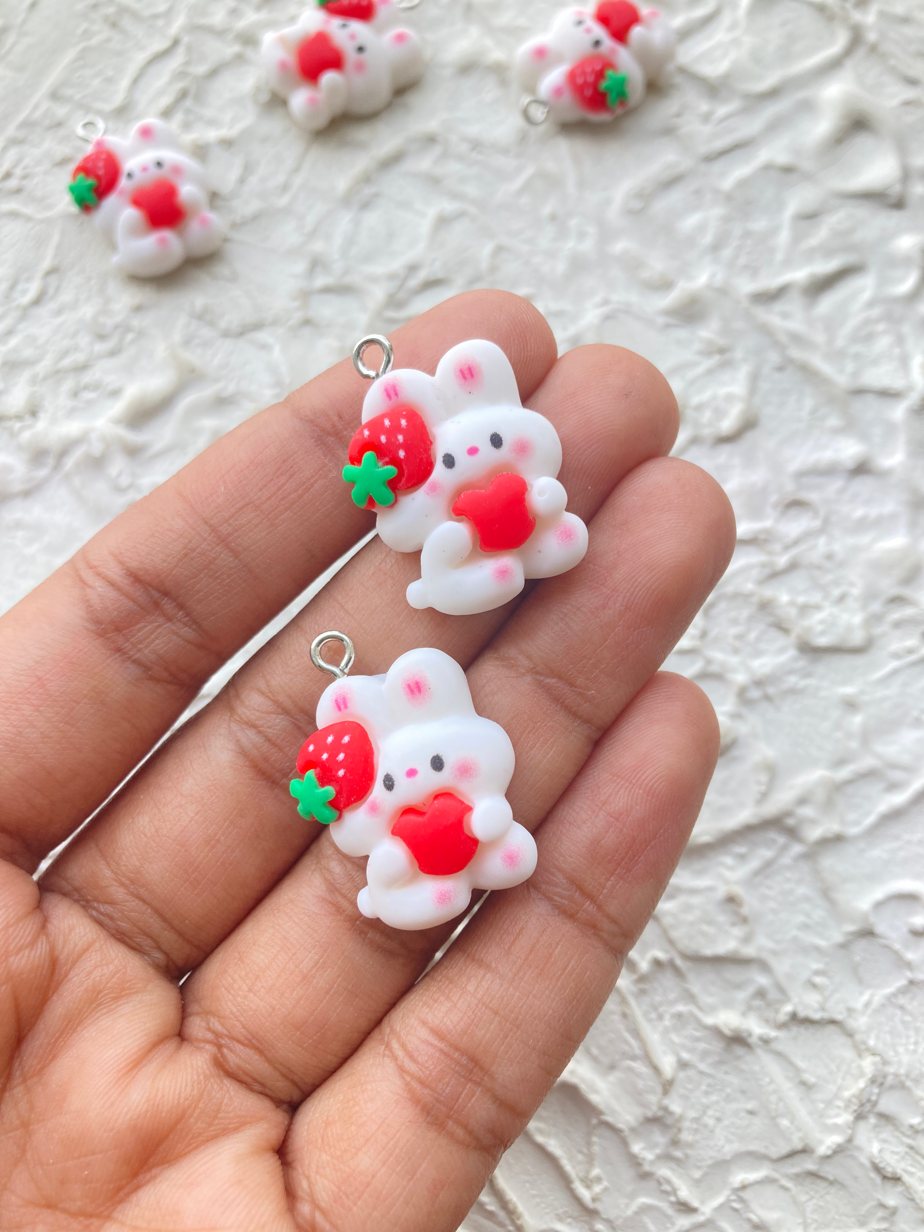 Resin bunny with heart and strawberry charm