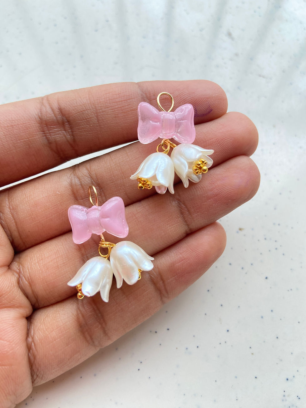 Thumbnail: Bell pattern charm made from flower & bow bead charm