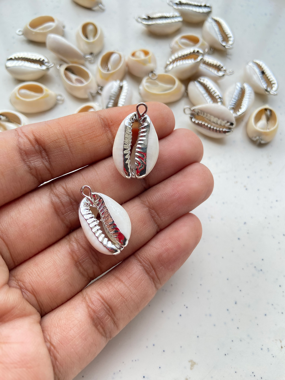 Thumbnail: Electroplated natural cowrie charm