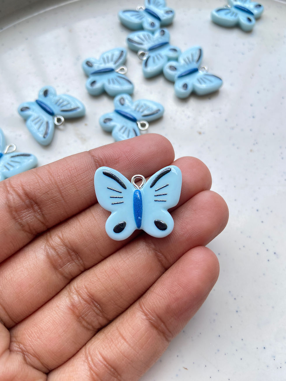 Thumbnail: Colourful resin butterfly charm