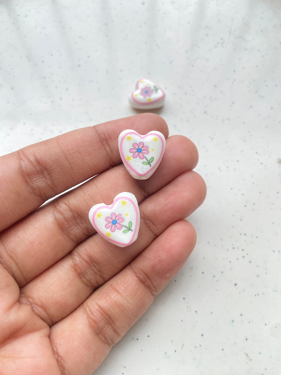 Thumbnail: Porcelain heart shape with tiny flower design bead, vertically drilled (1pc)