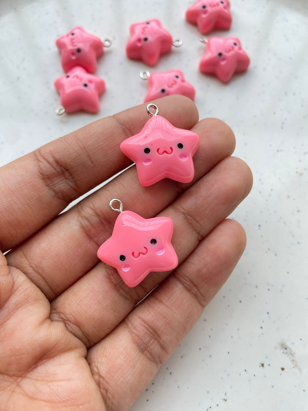 Thumbnail: Colourful star with blush face resin charm