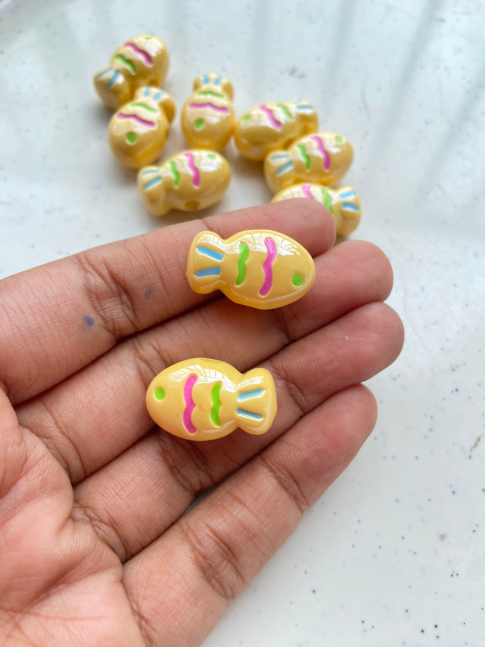 Thumbnail: Shiny acrylic fish bead, side drilled