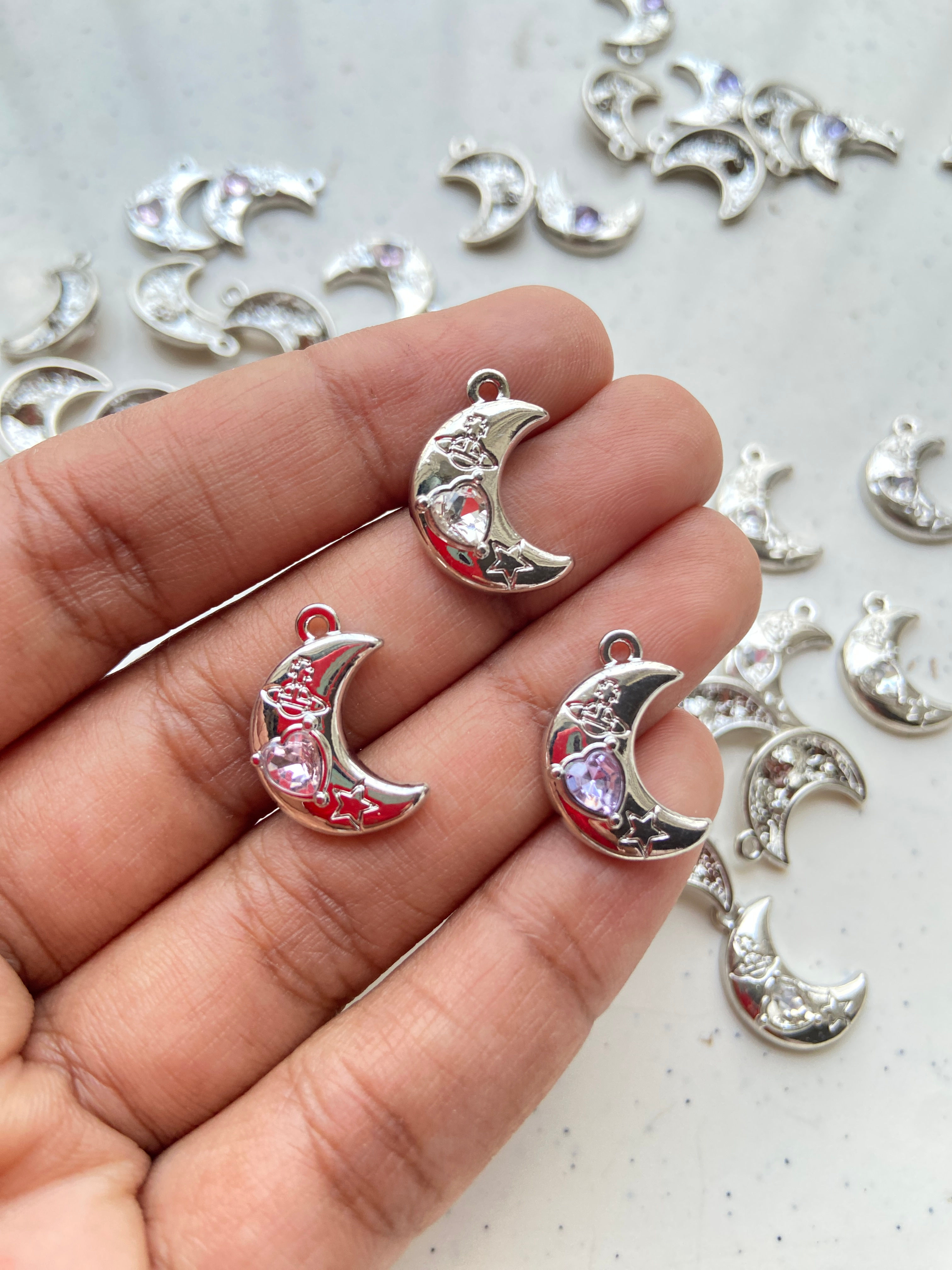 Zircon heart embedded alloy moon charm