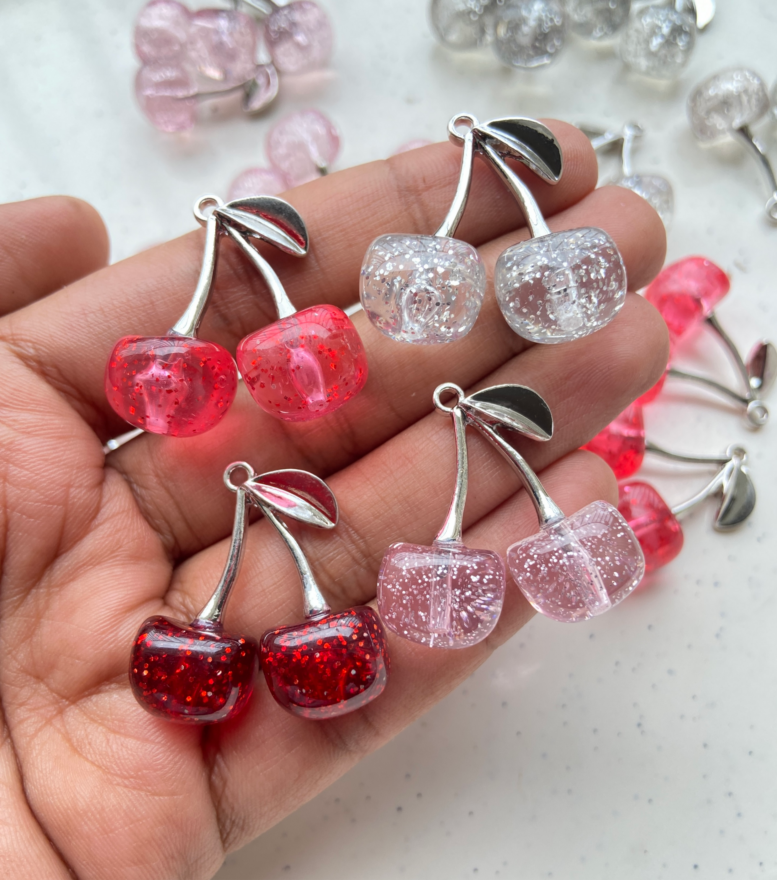 Silver cherry resin with glitter alloy charm