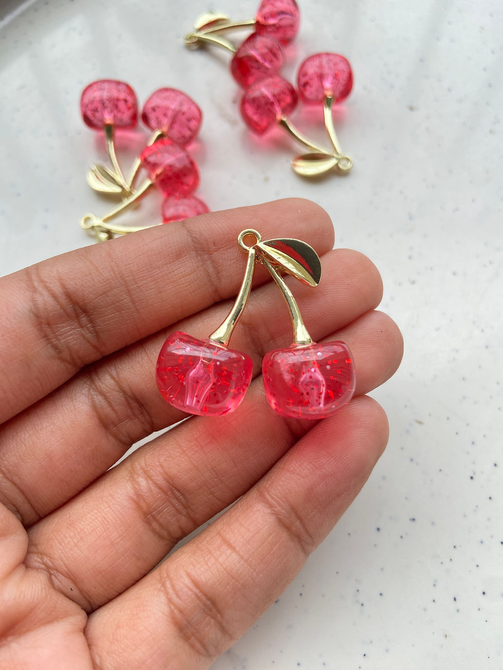 Thumbnail: Golden cherry resin with glitter alloy charm