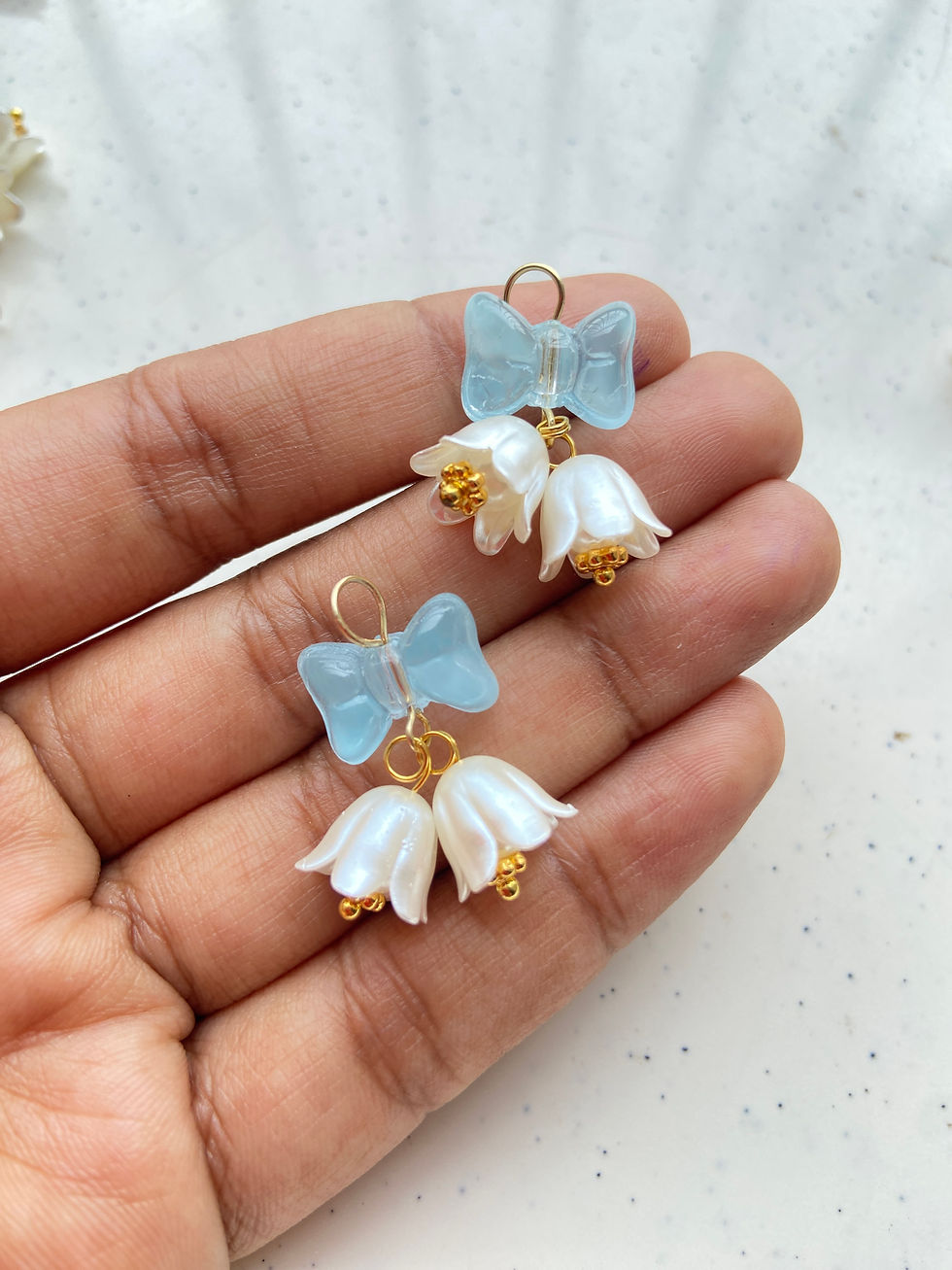 Thumbnail: Bell pattern charm made from flower & bow bead charm