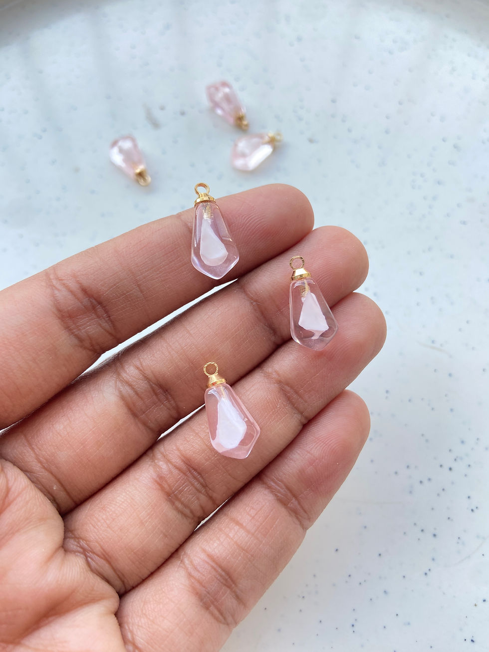 Thumbnail: Pomegranate seed resin charm