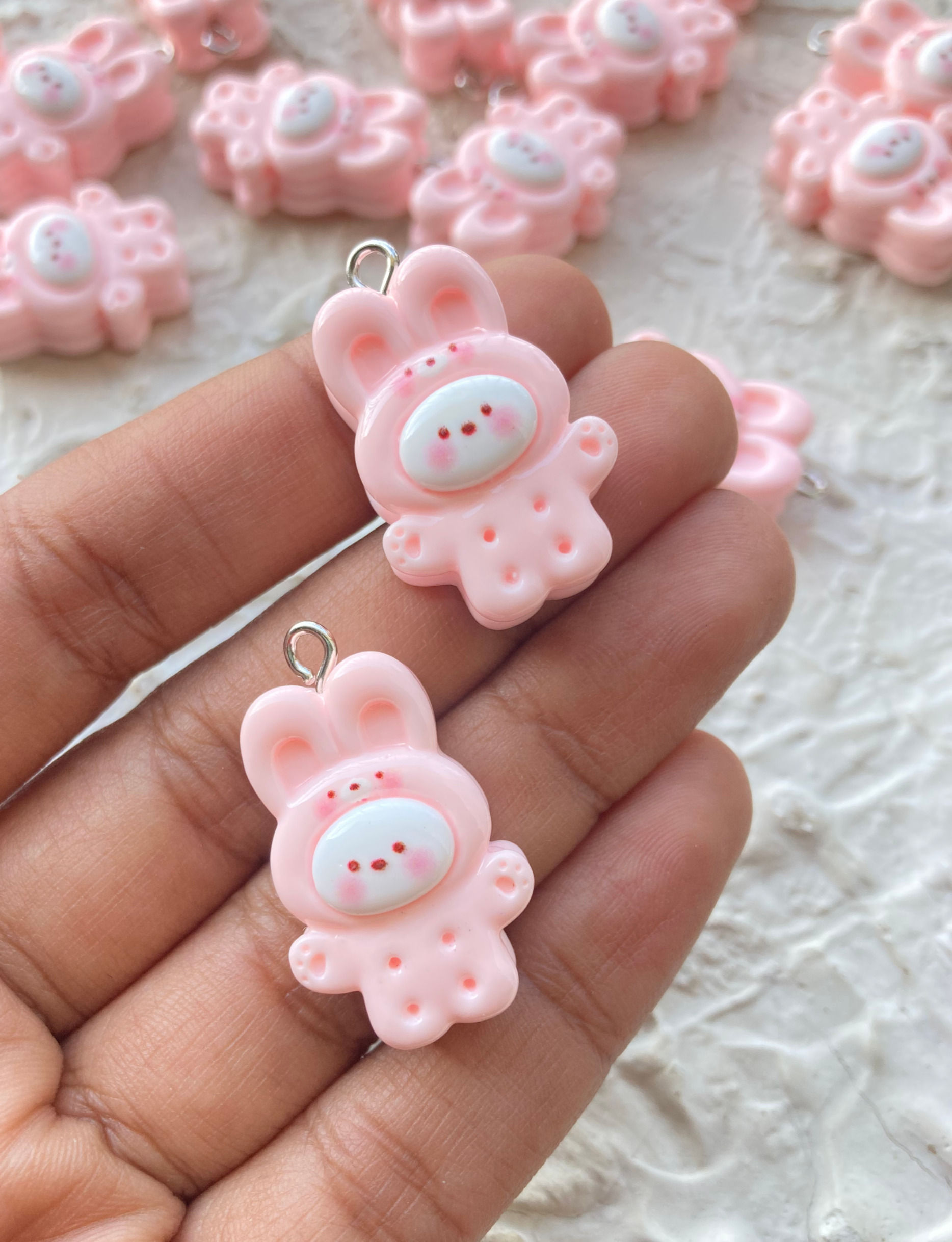 Pink bunny with cute face resin charm