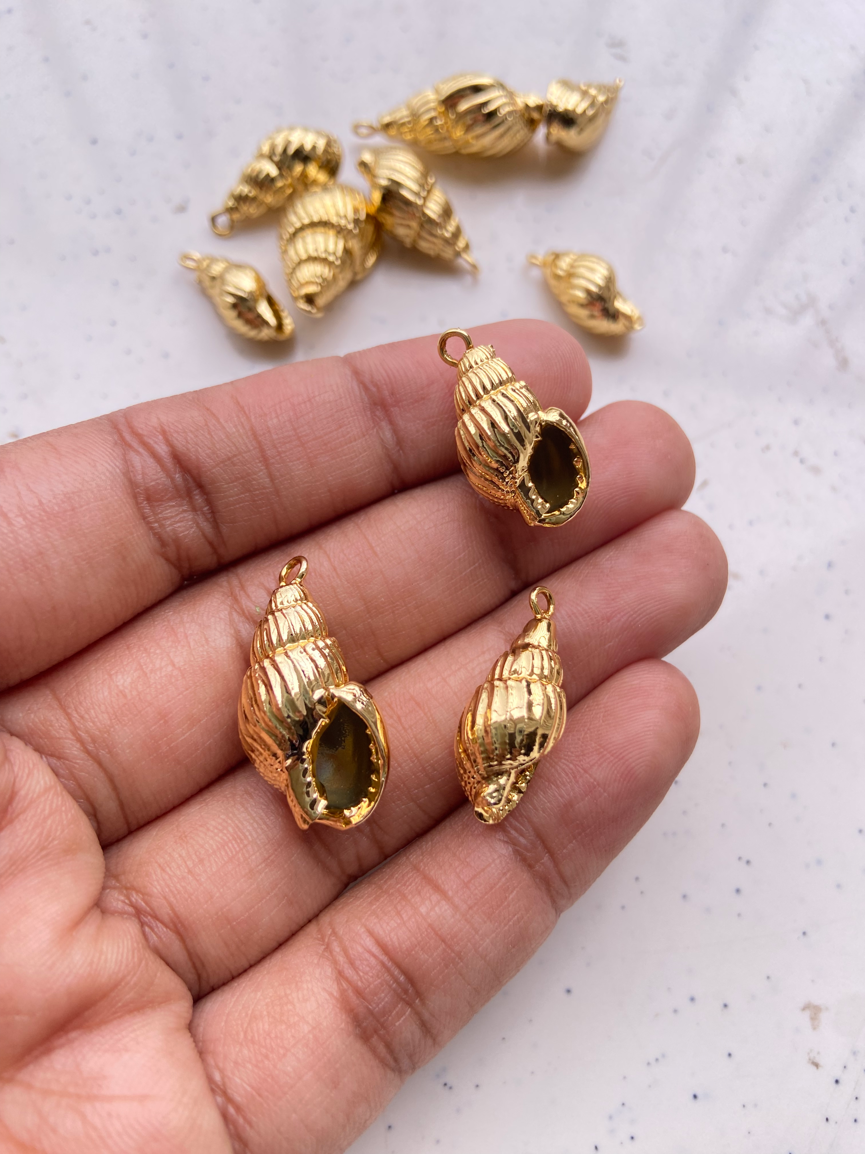 Electroplated hollow counch charm