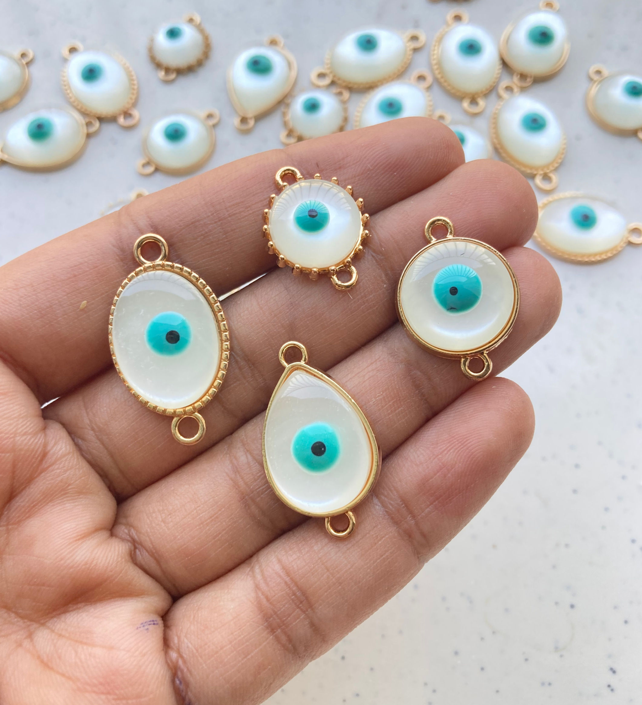 Different shape evil eye connector