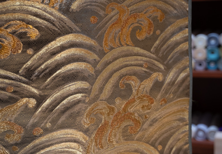 A gold kimono fabric with Japanese drawings