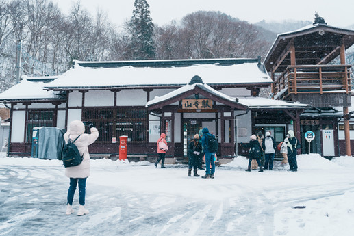 Historic station building surrounded by snow in Tohoku.