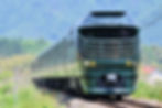 Luxury Twilight Express Mizukaze train traveling through the Japanese countryside.