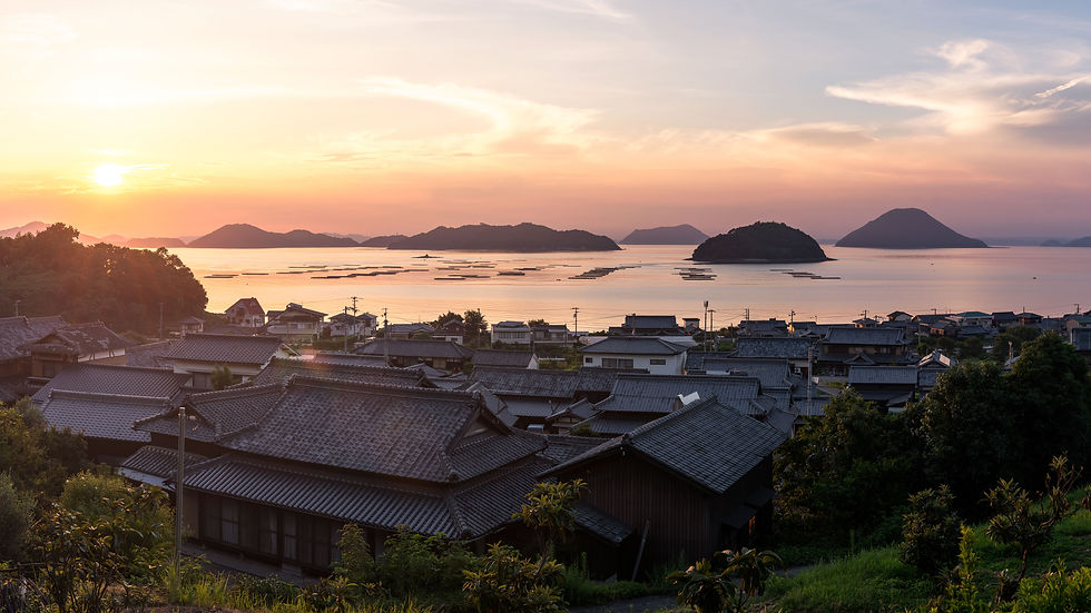 Sunset over rooftops and islands in the Seto Inland Sea, Japan