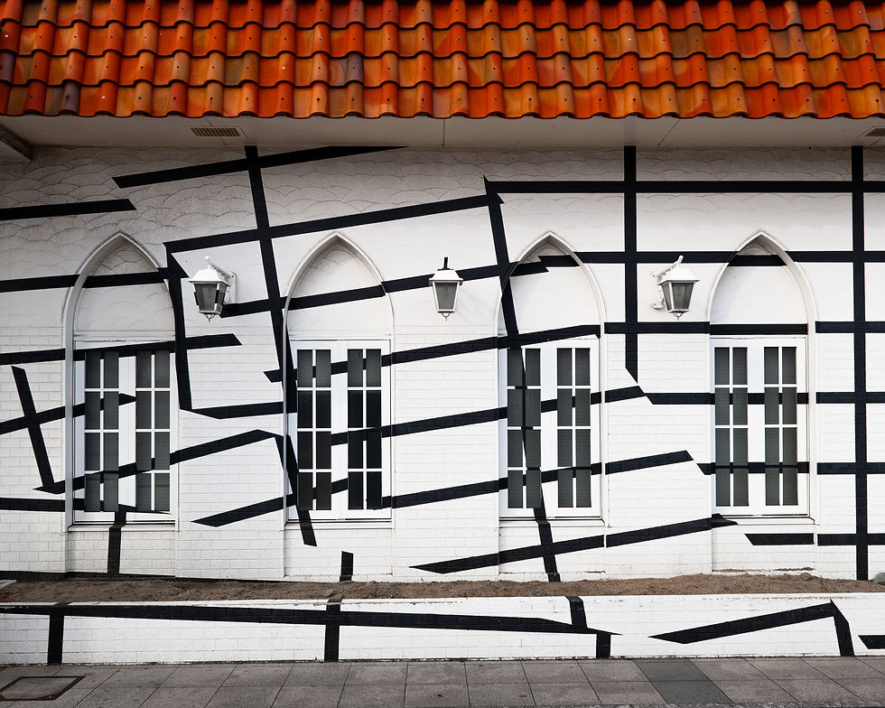 Esther Stocker’s geometric black-and-white line artwork on the exterior of Uno Station, Japan