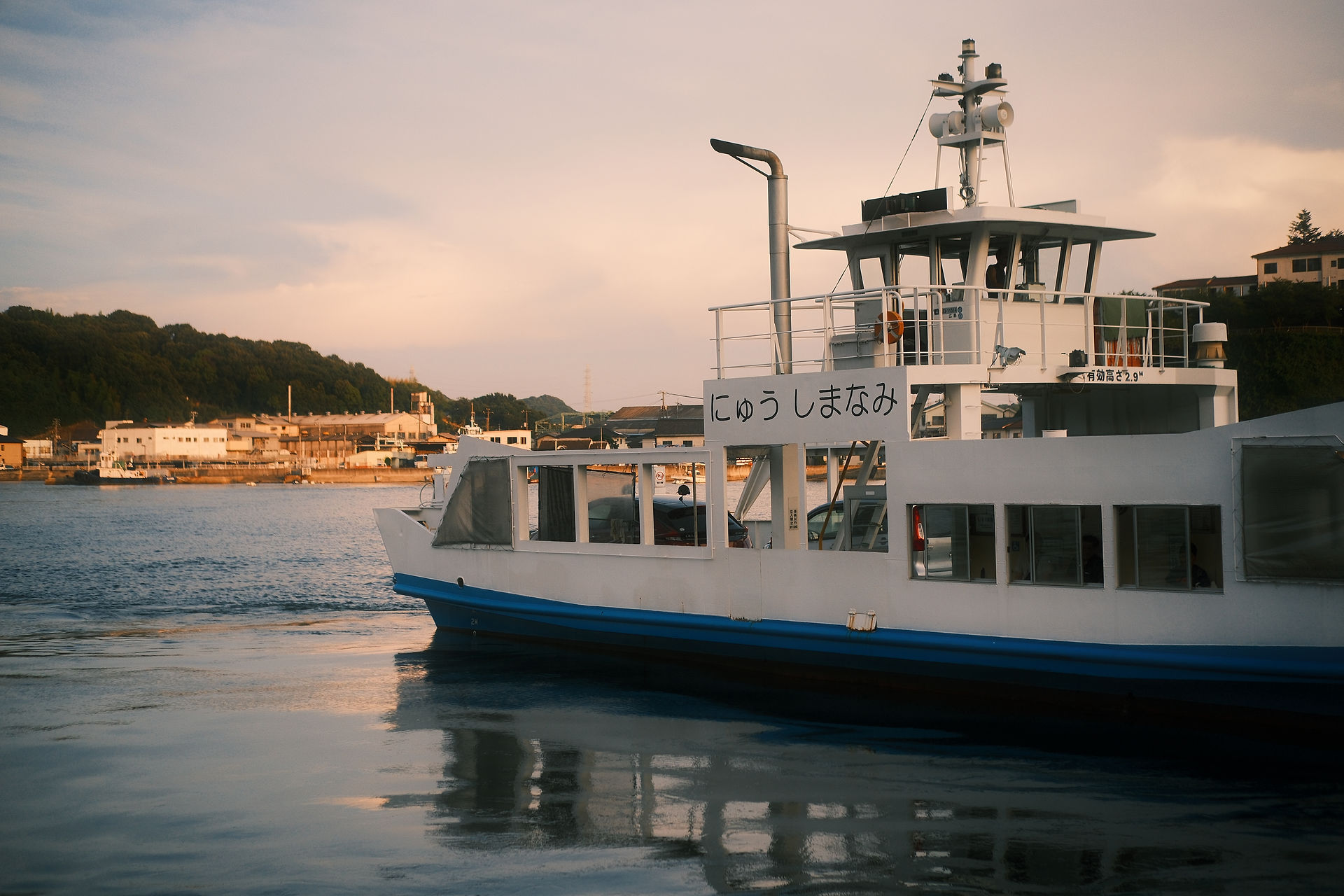 A scenic view with a boat at a port as the foreground