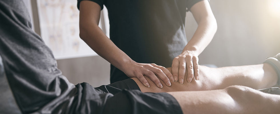 Sports message being performed on a male clients leg