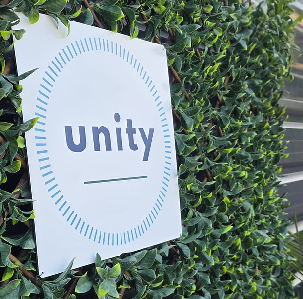 Unity sign on green leaves at the front of Unity Practice