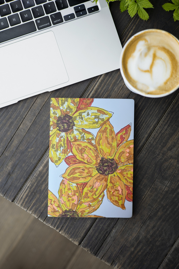 Book beside the laptop_Sunflowers.png