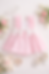 Pastel pink baby dress flat lay