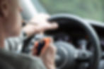 Man in car smoking a cigarette 