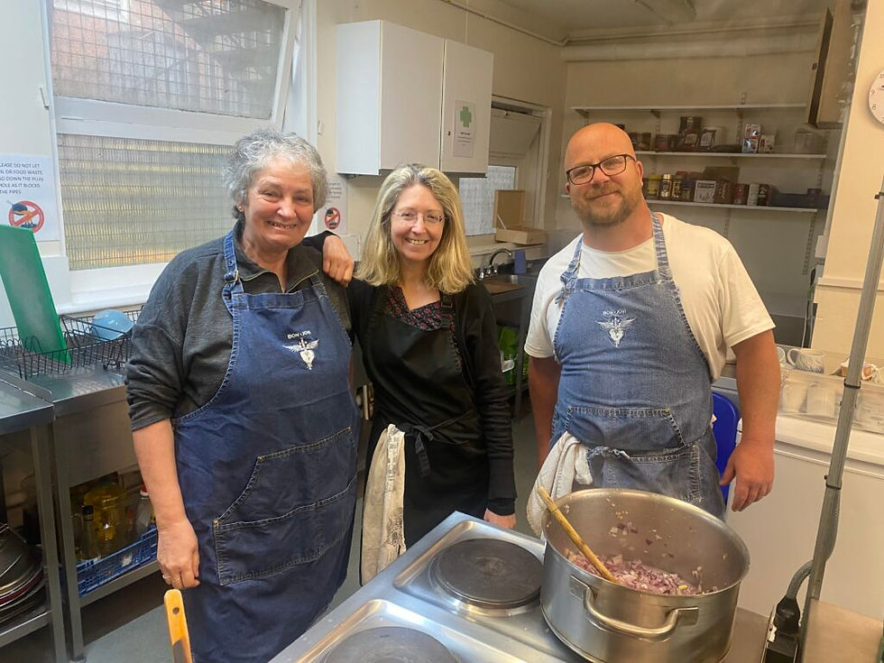 Trevor volunteering in the kitchen with Anne and Julie