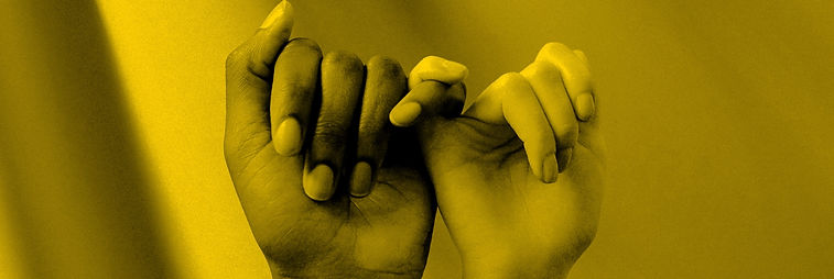 Two hands, one black one white, with interlocking little fingers