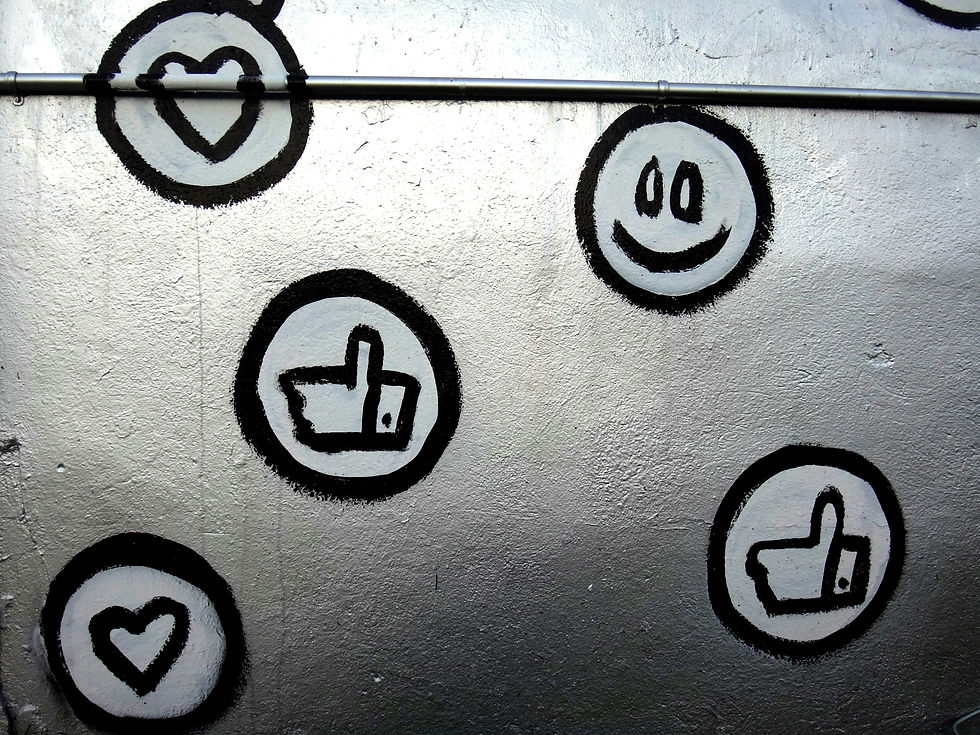 Social media icons painted on a silver wall