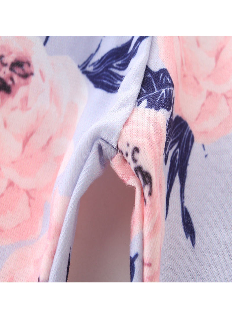 Thumbnail: Ruffle sleeved drop back top with floral trousers