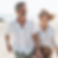 Couple smiling while walking on beach