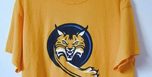 Student a Bit Too Attached to Their Yellow QU Orientation Shirt