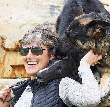 Kathryn Gordon, MSW, KPA-CTP, CCPDT-KA, having fun with her two working dogs