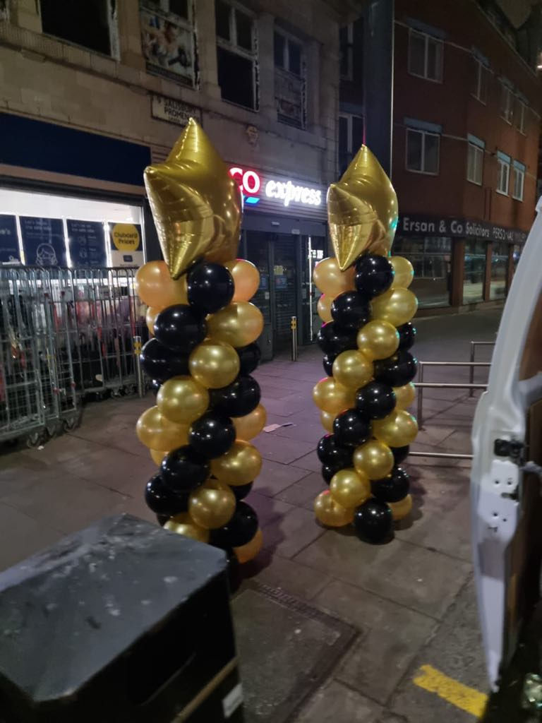 Corporate balloon decorations London outside a venue.