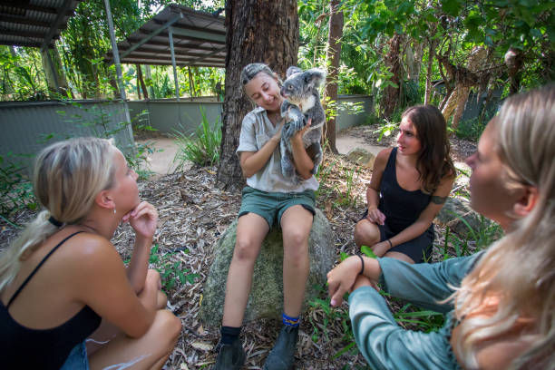 girls playing with koala