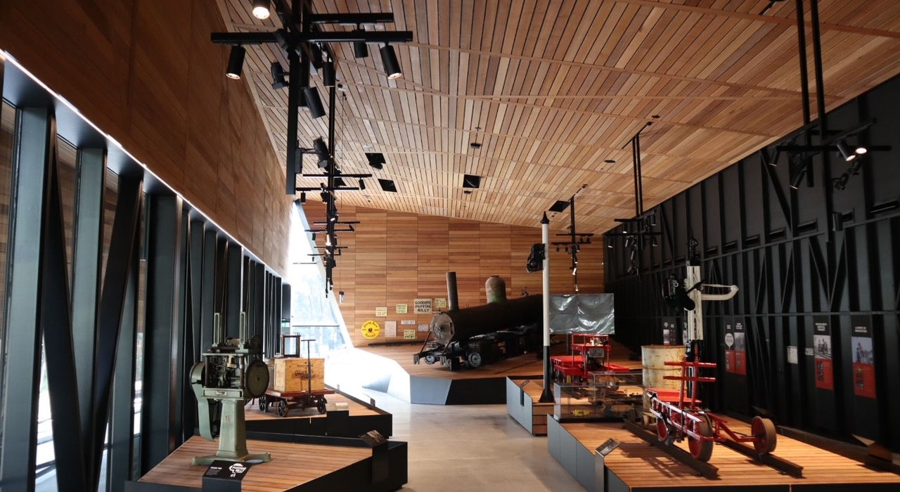 “Interior of train station with timber ceiling and seating area.”