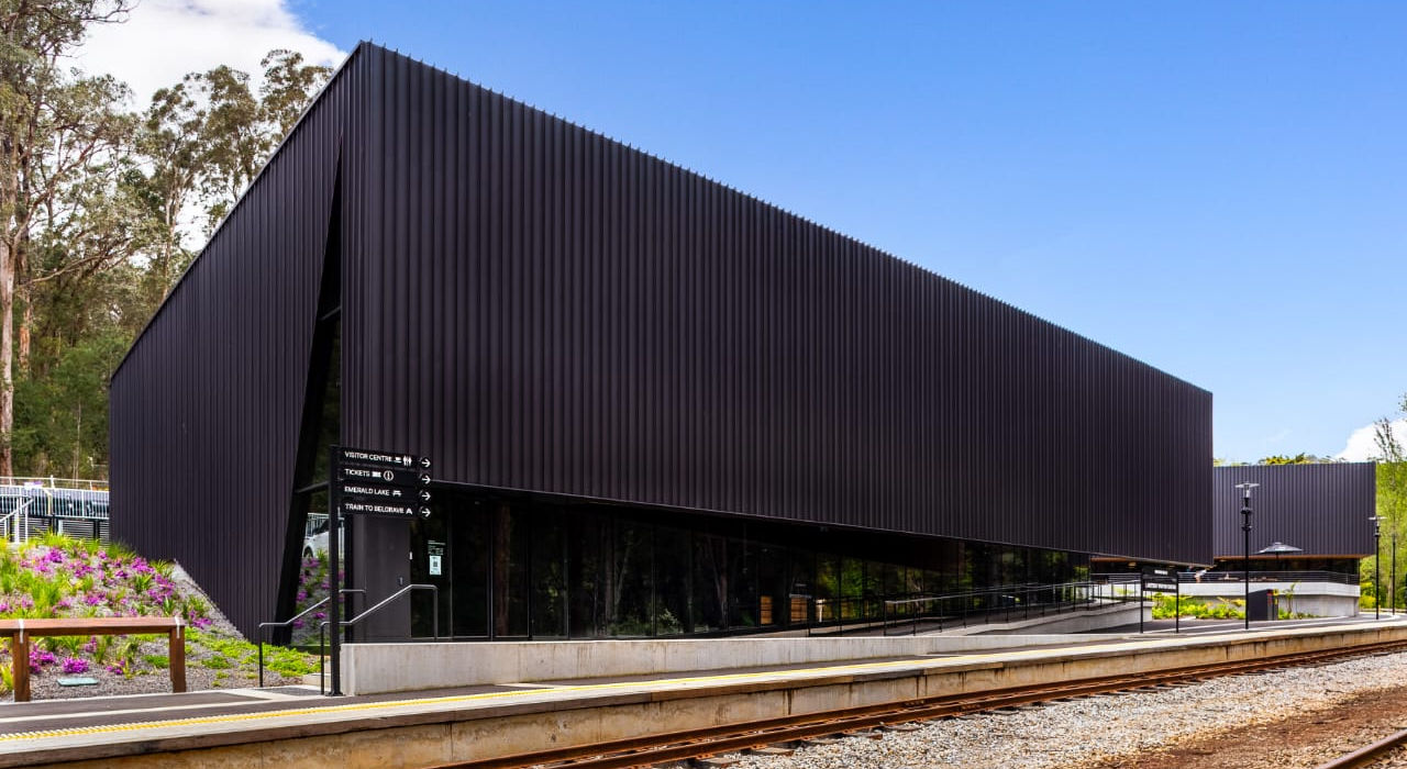 “Modern railway museum building with geometric black façade.”
