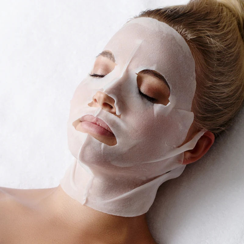Professional recovery sheet mask applied to skin post-microneedling treatment to support hydration, barrier repair, and collagen stimulation.