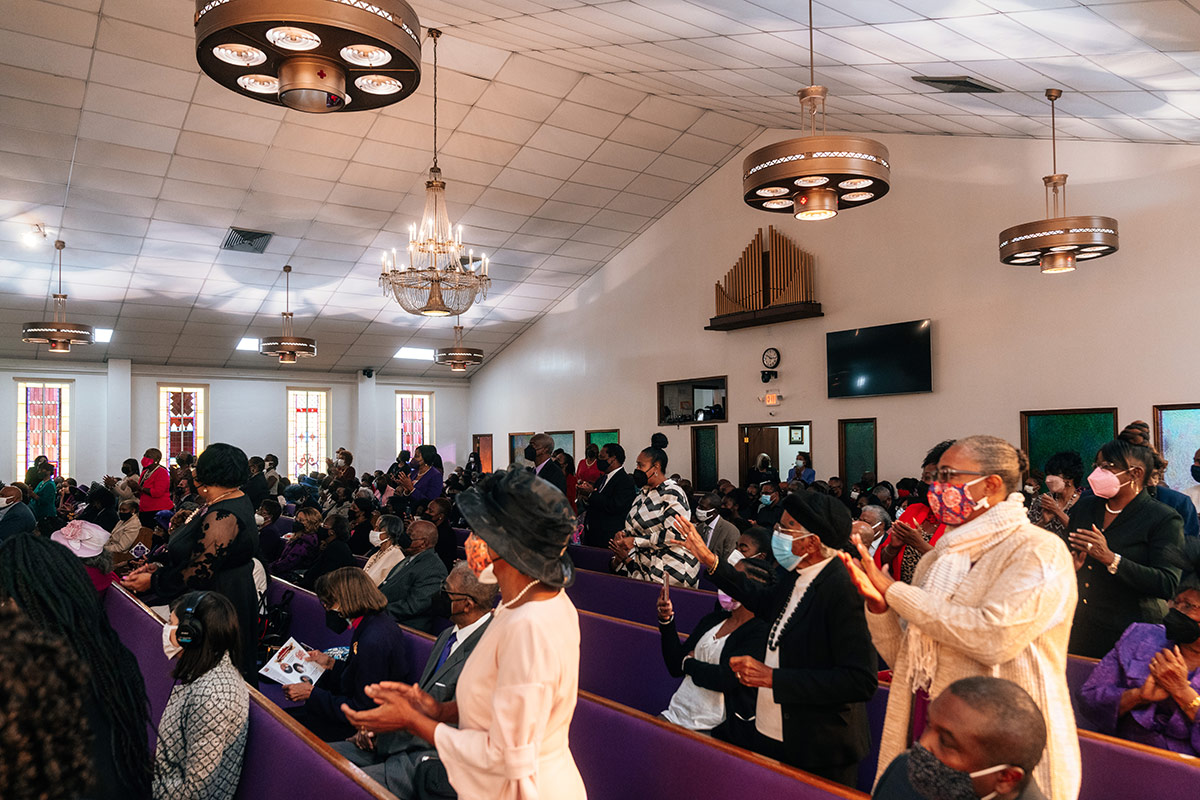 Diverse group of African American professionals gathered at a church community event