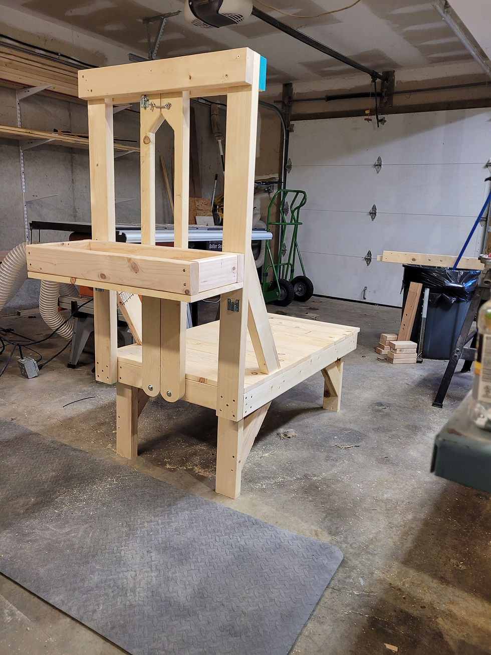 Thumbnail: Handcrafted wooden goat milk stand with adjustable stanchion and sturdy base  in large