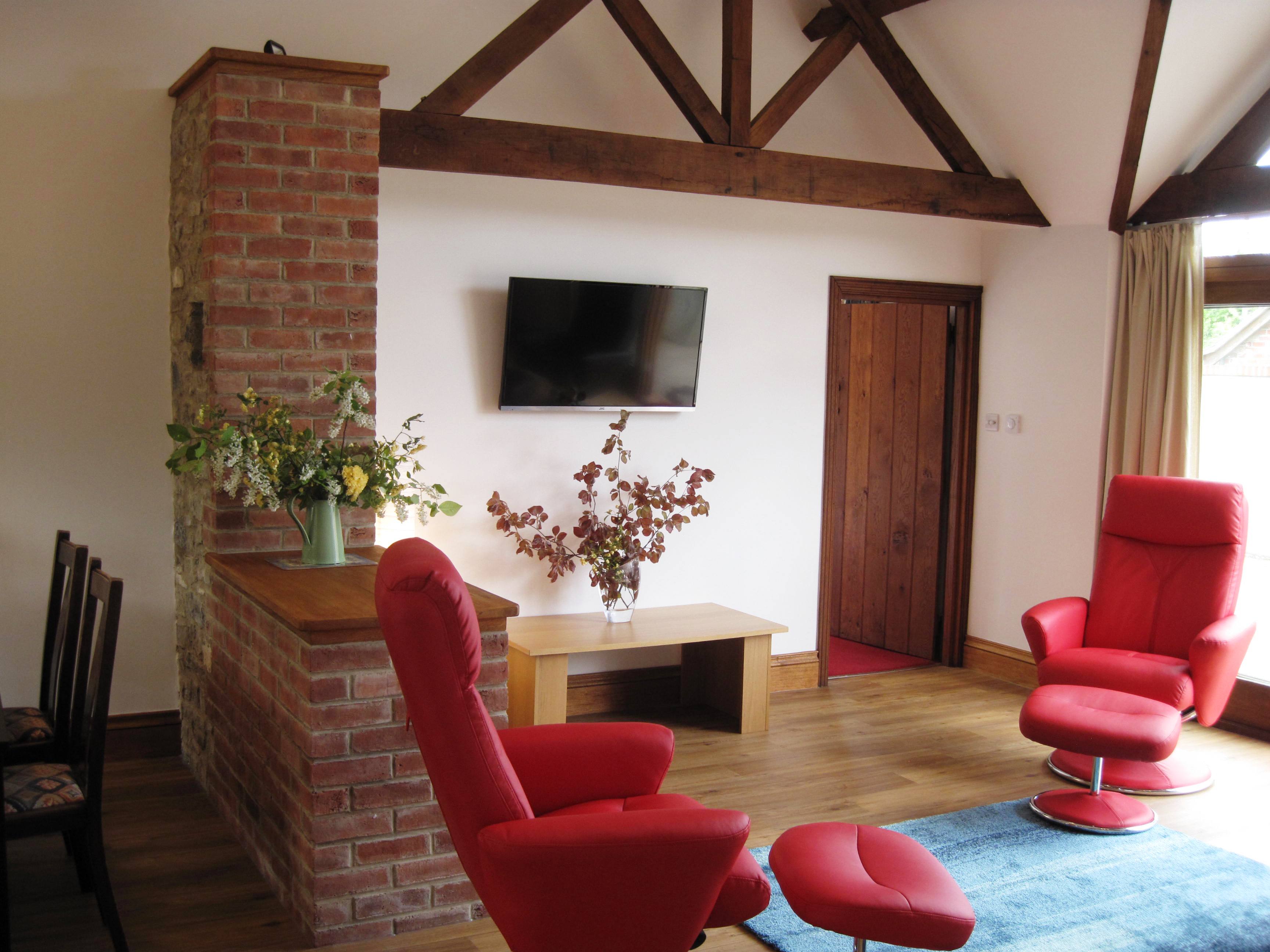 Stone barn sitting area and TV IMG_1823