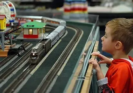 kid looking at model train