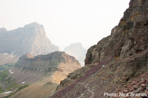 A climber’s trail shrouded in smoke in Glacier National Park